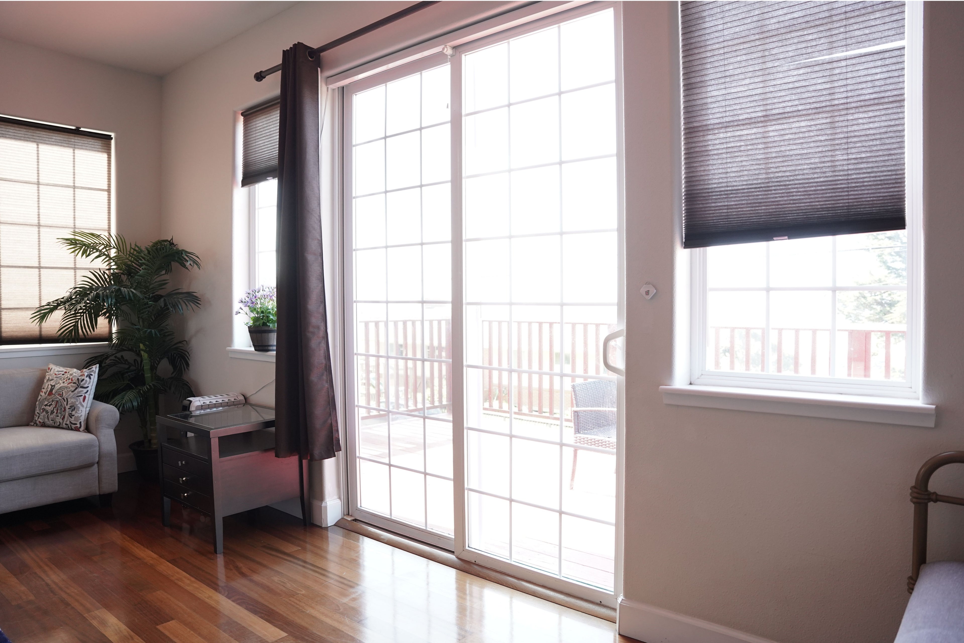 SmartSlydr automatic sliding door opener installed in a stylish home—providing hands-free access for both pets and humans with smart home convenience.