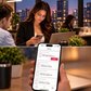 Woman checking the SmartSlydr app for a dog door notification and activity history while at work